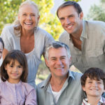 Family smiling together after a visit to the dentist
