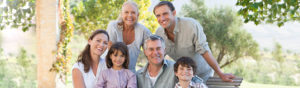 Family smiling together after a visit to the dentist